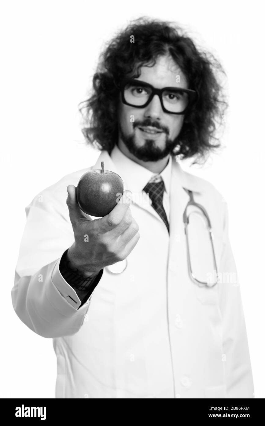 Studio geschossen von stattlicher Mann Arzt, der rote Apfel mit Schwerpunkt auf Apple Stockfoto