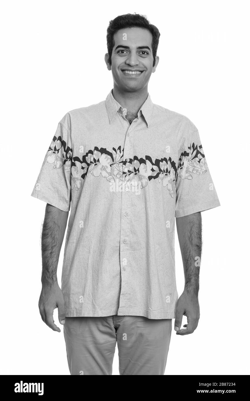 Fröhlicher junger persischer Tourist lächelnd bereit für Urlaub Stockfoto Fröhlicher junger persischer Tourist lächelnd bereit für Urlaub Stockfoto