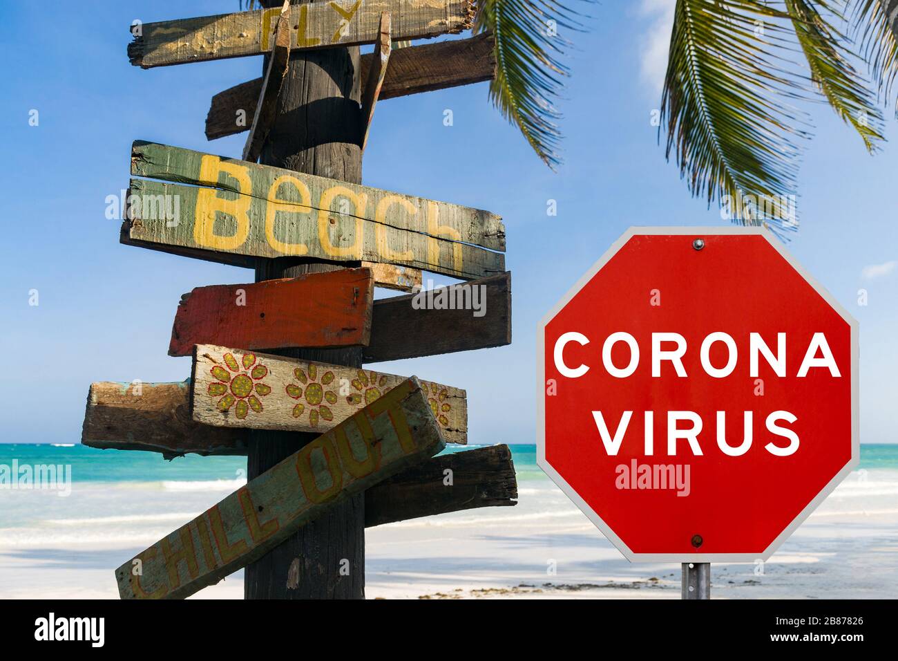 Zusammengesetztes Konzeptbild mit Corona-Virus-Coronavirus-Warnschild vor tropischem Strand und Ozean, das Reisebeschränkungen aufgrund einer Pandemie zeigt Stockfoto