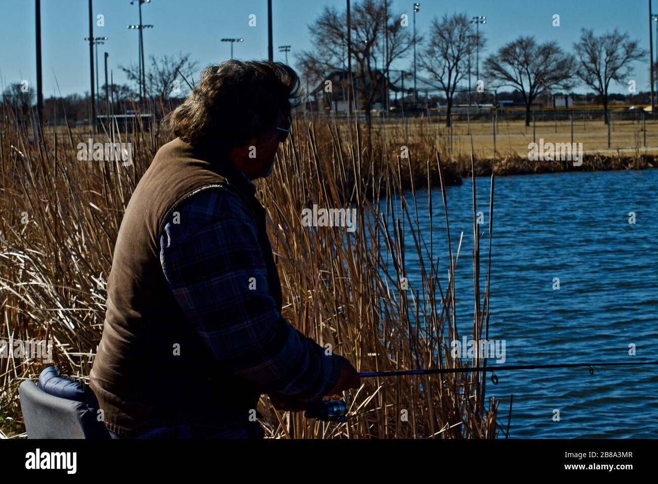 Angeln im Lindsey City Park Public Fishing Lake, Canyon, Texas Stockfoto