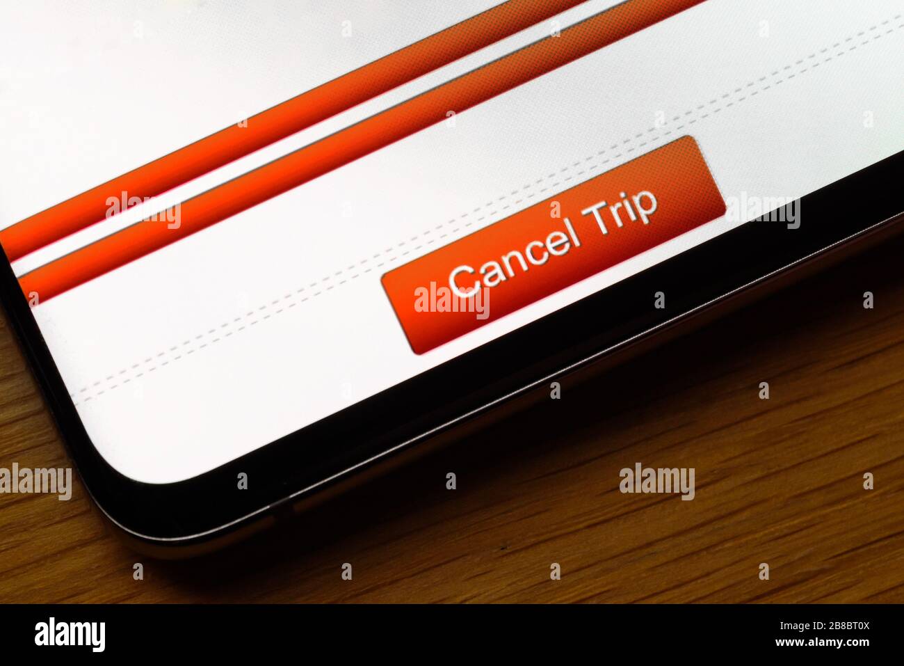Schaltfläche "Reisetext abbrechen" auf dem Smartphone-Bildschirm. Stockfoto