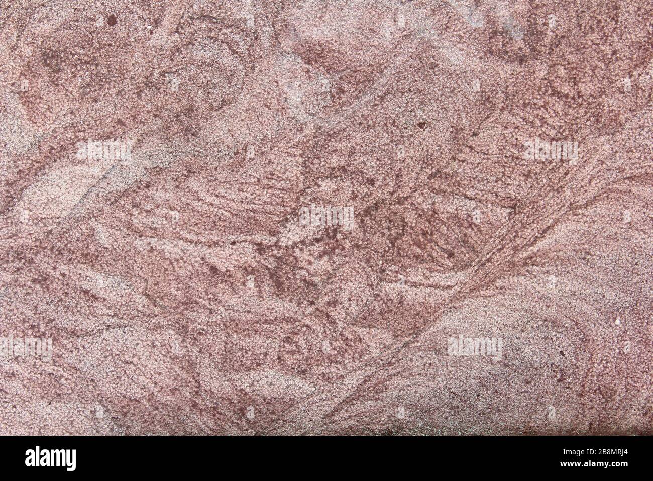 Natürliche Textur aus rosafarbenem Granit. Hintergrund für Text und Design. Stockfoto