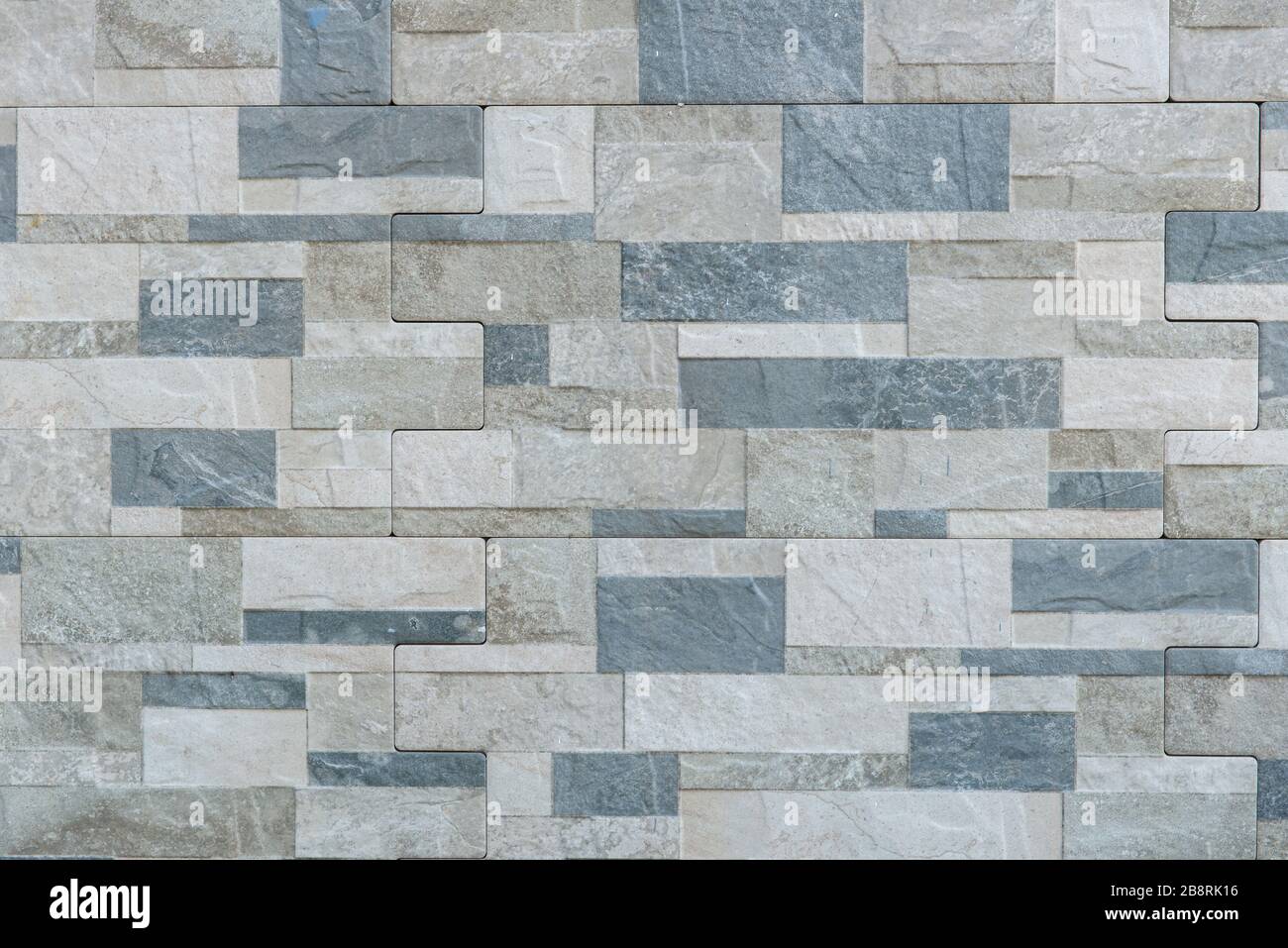 Hintergrund der modernen Schiefer Stein Ziegel Wand aufgetaucht für Design. Stockfoto