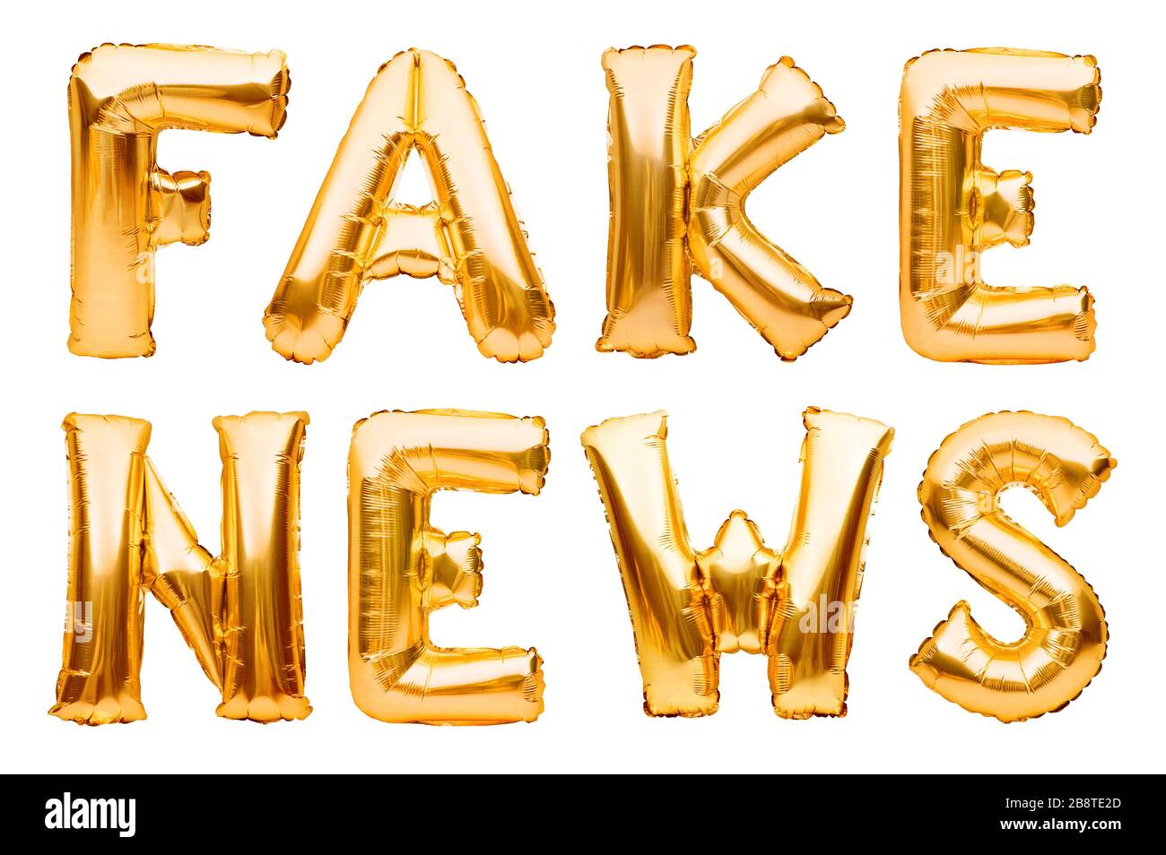 Wörter FAKE NEWS aus goldenen aufblasbaren Ballons isoliert auf weißem Hintergrund. Helium Luftballons Goldfolie bildet Wortnachrichten. Startup, Großeröffnung Stockfoto