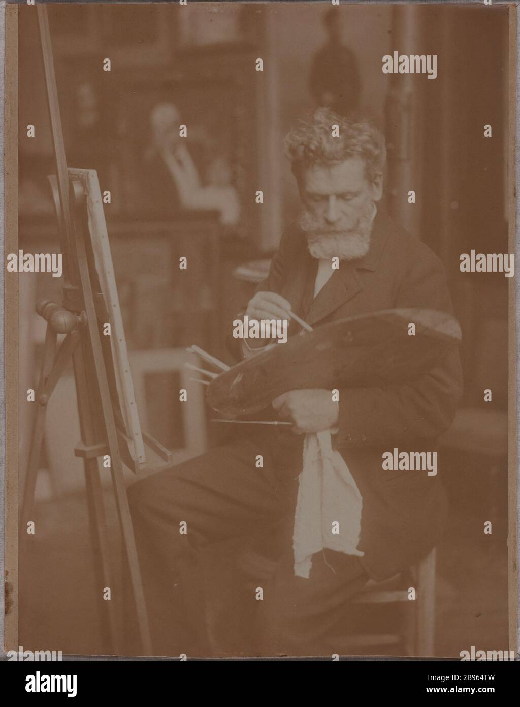 Alfred Roll Malerei in ihrem Atelier Anonyme. "Alfred Roll peignant dans son atelier". Tirage sur Papier albuminé, fin XIXe-début XX siècle. Musée des Beaux-Arts de la Ville de Paris, Petit Palais. Stockfoto