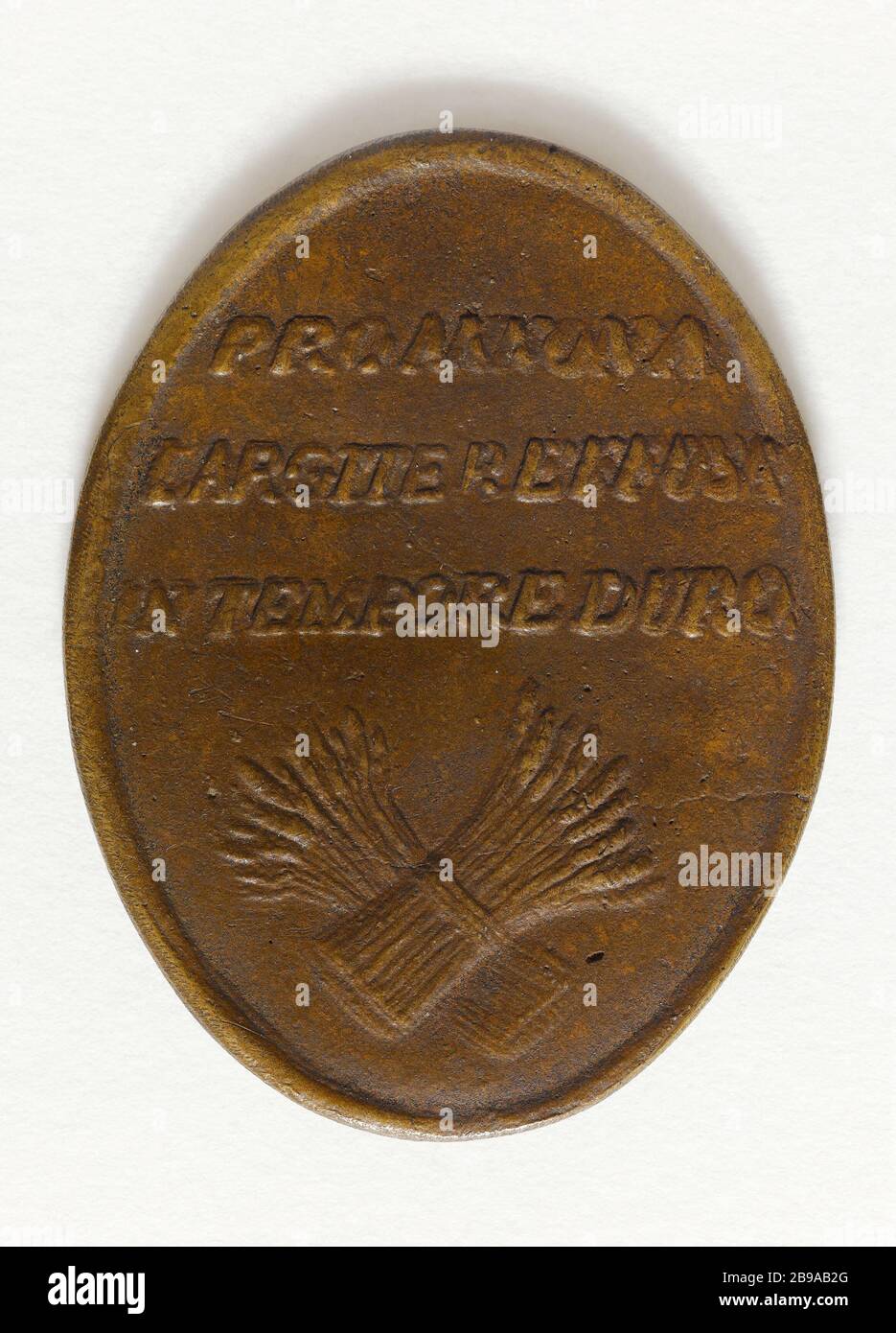 MEDAILLE DER STADT NICOLAS A MEAUX TRONCHON, INHABER MARTIN EINE LÜCKE IN ANERKENNUNG DER VON IHM ANGEBOTENEN GETREIDEERLEICHTERUNGEN ZEIT DER KNAPPHEIT, 6. NOVEMBER 1789 ANONYME. Médaille décernée par la ville de Meaux à Nicolas Tronchon, propriétaire à Fosse Martin, en reconnaissance des secours en grain offerts par lui en temps de disette, 6 novembre 1789. Bronze. 1789. Paris, musée Carnavalet. Stockfoto
