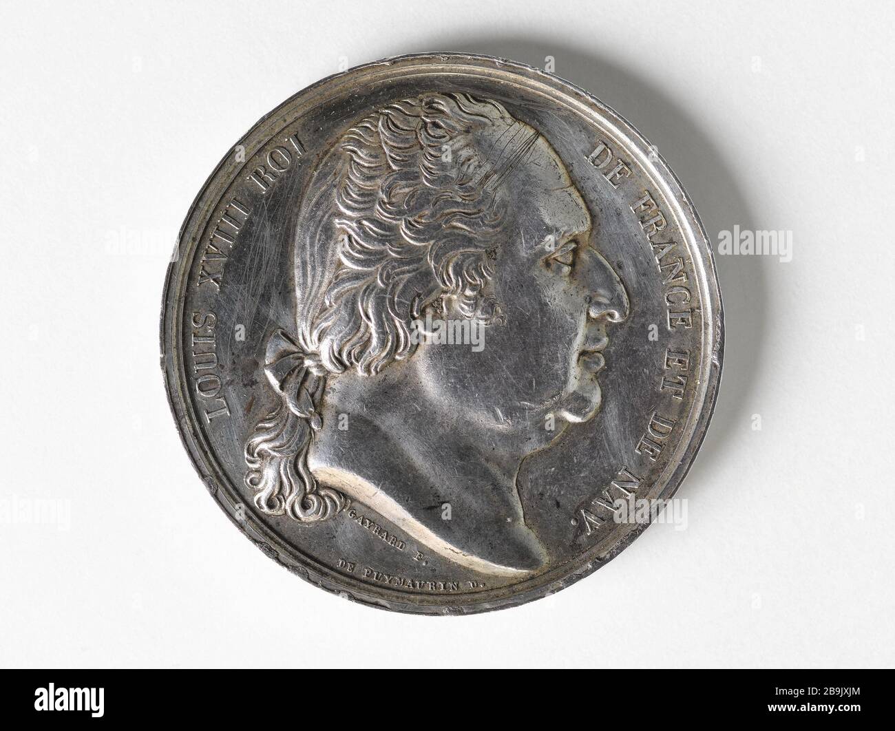 MP-Medaille in der Abgeordnetenkammer der Departements Pierre-François Audry de Puyraveau (1773-1852), 181 Raymond Gayrard (1777-1858). Portrait de Louis XVIII, roi de France et de Navarra. Médaille de député à la Chambre des députés des départements de Pierre-François Audry de Puyraveau (1773-1852). Argent. Im Jahre 181. Paris, musée Carnavalet. Stockfoto