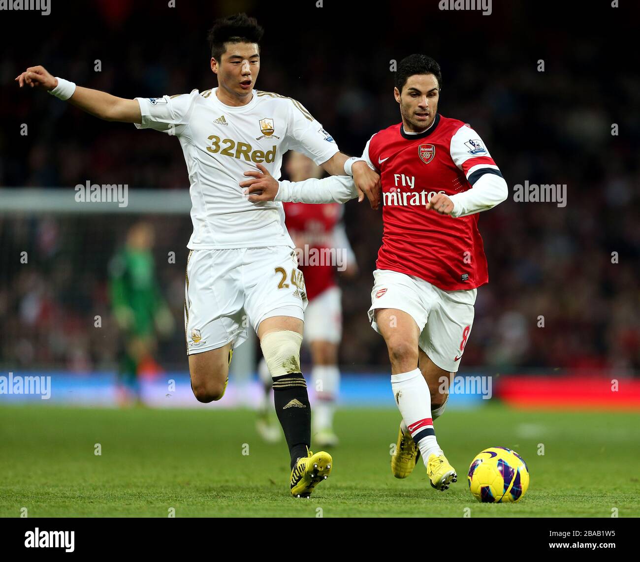 Arsenals Mikel Arteta und Swansea City kämpfen um den Ball Stockfoto