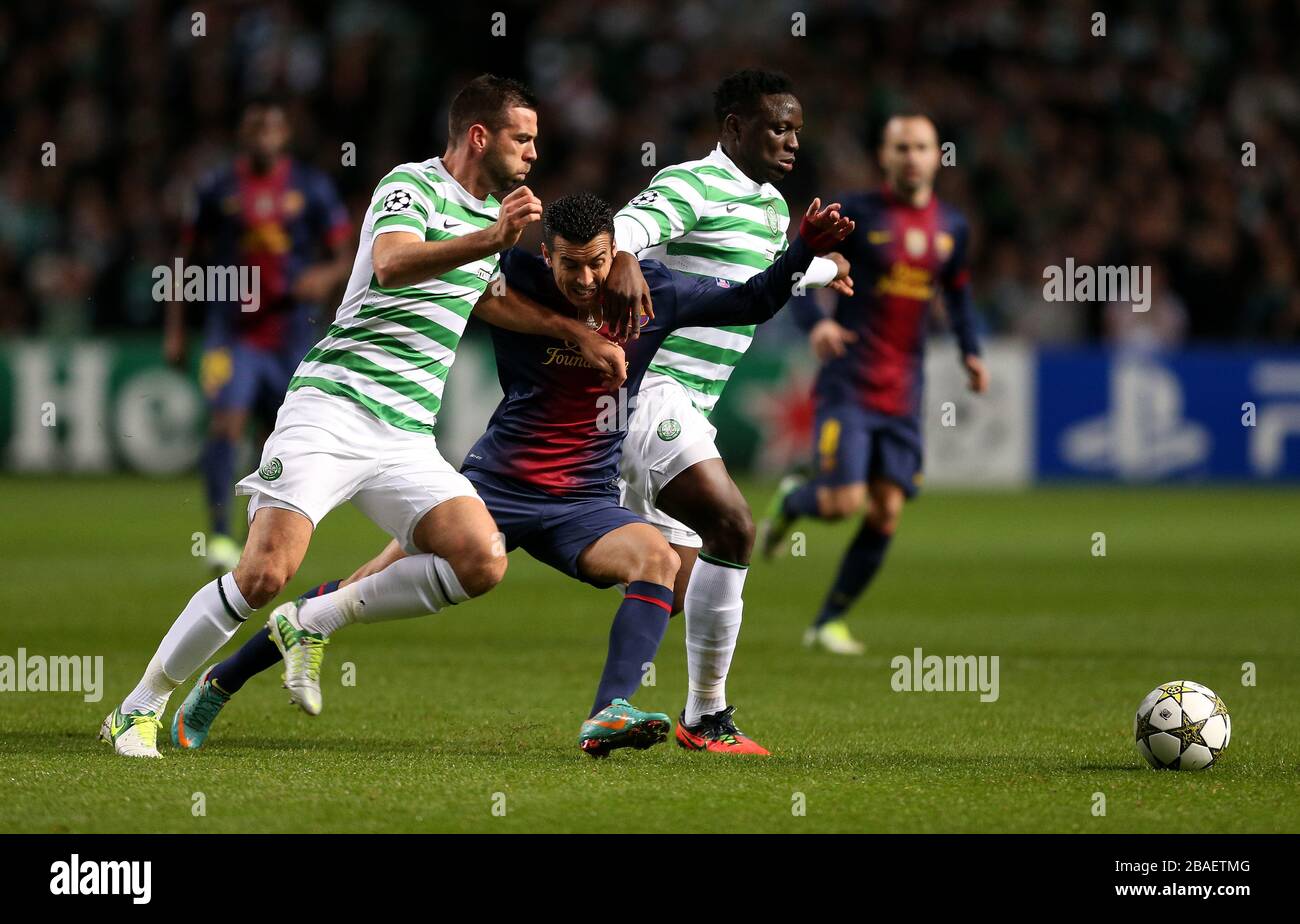 Victor Wanyama (rechts) von Celtic und Joe Ledley in Aktion mit Pedro Rodriguez von Barcelona Stockfoto