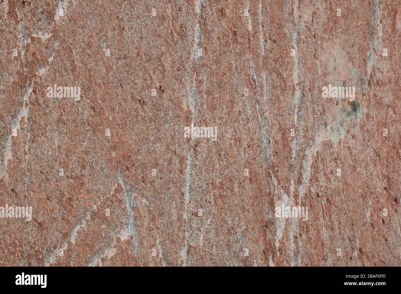 Gelb-rote und orangefarbene Textursteinfliese für Gebäude und Konstruktion Stockfoto