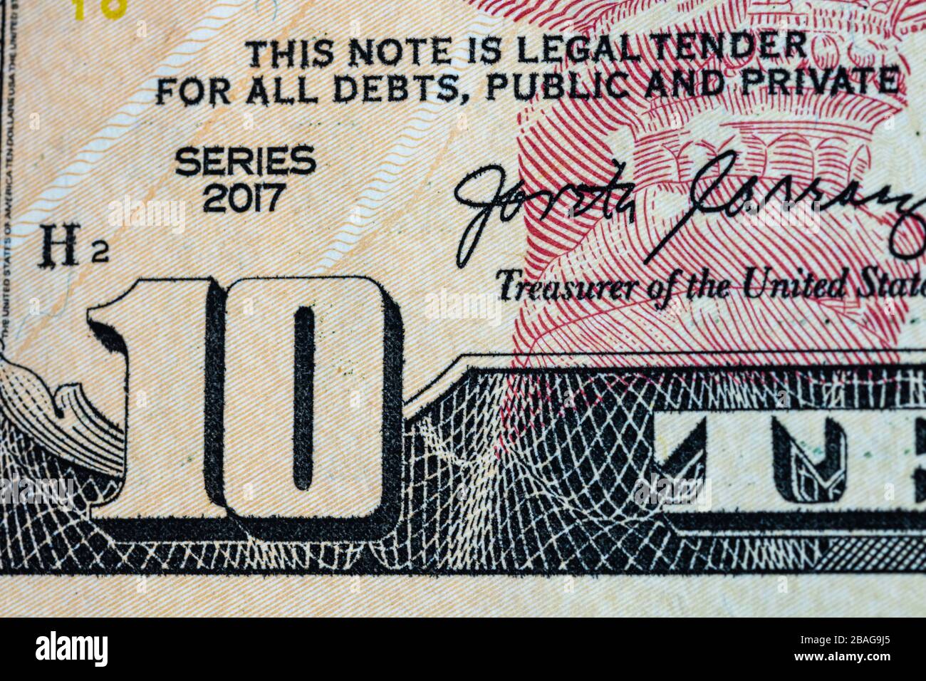 Nahaufnahme der Makrodetails von Geldscheinen in US-Dollar, Detailfoto von US-Dollar. Weltgeldkonzept, Inflation und Sparkonzept Stockfoto