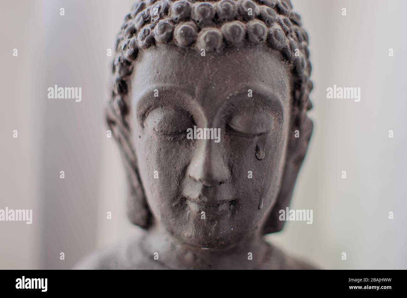 Weinender Buddha Stockfoto