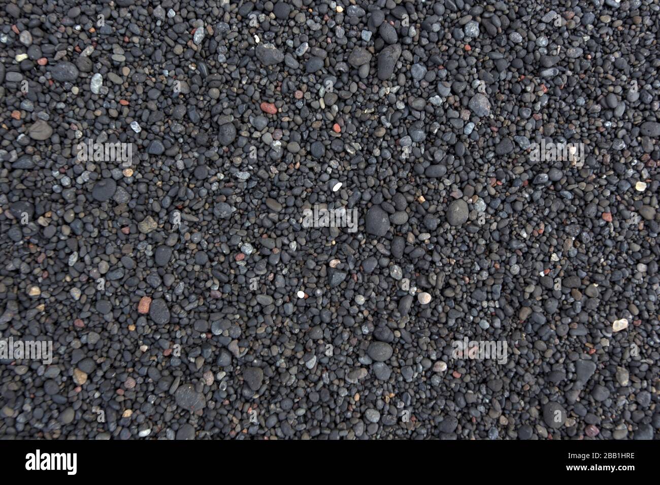 Ein Hintergrund aus schwarzem vulkanischem Sand, Indonesien Stockfoto