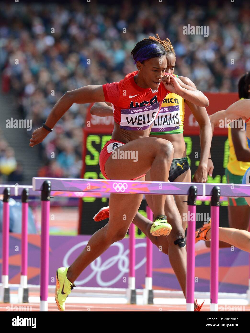 US-Kellie Wells im Einsatz bei den 100-m-Hürden der Frauen heizt im Olympiastadion Stockfoto