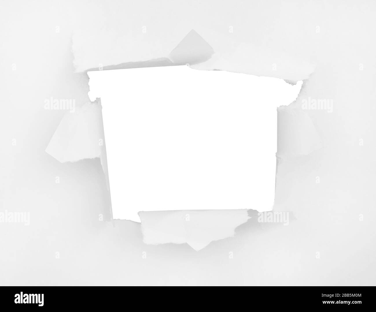 Ein zerrissenes Stück Papier. Der zerrissene Ort ist für Ihr Design völlig isoliert Stockfoto