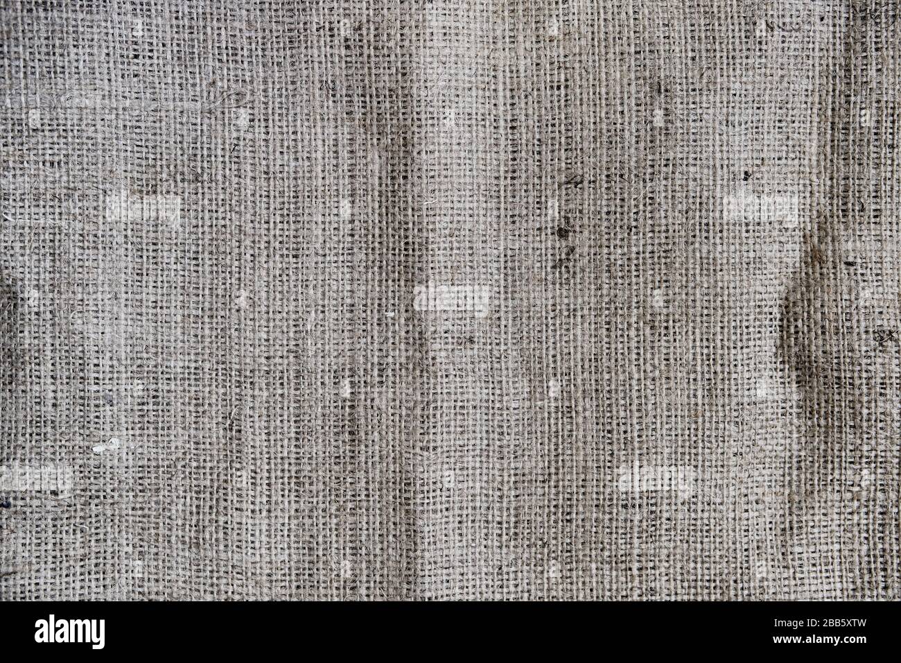 Vintage Burlap Hintergrund, Nahaufnahme. Grobes, strapazierfähiges Material, graue Jutefaserstruktur. Stockfoto