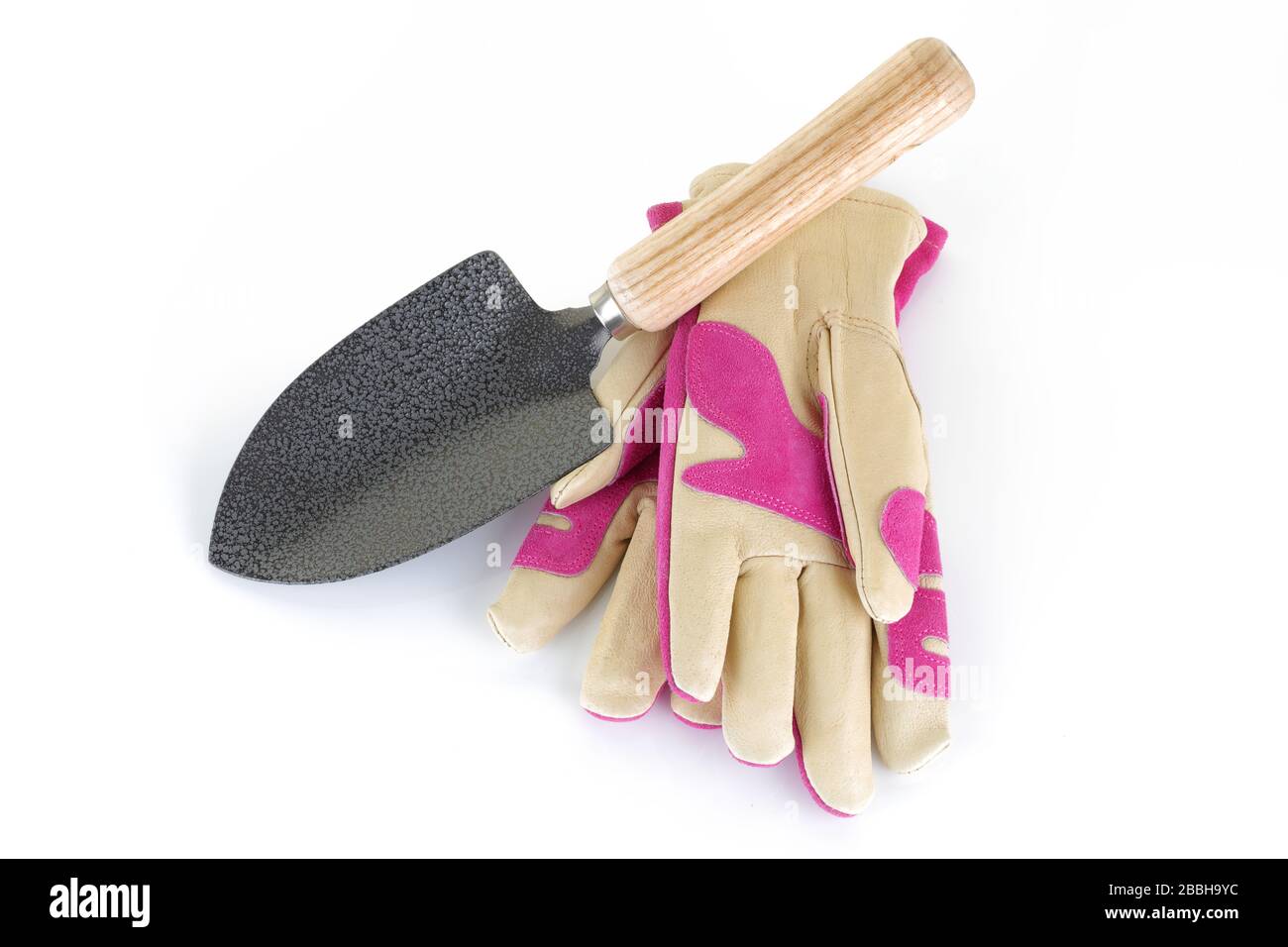 Damenhandschuhe und Trowel für den Garten Stockfoto