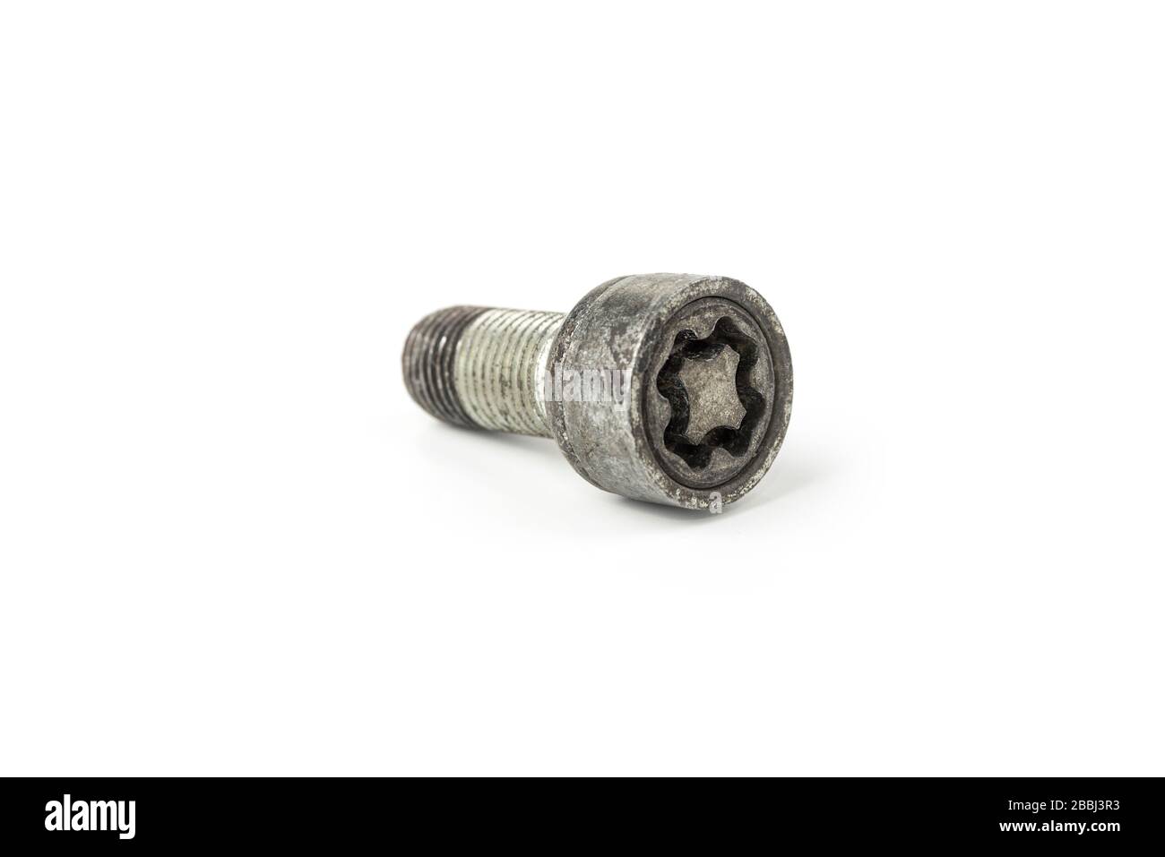 Sicherheitswagen an einem weißen Rad anschrauben Stockfoto