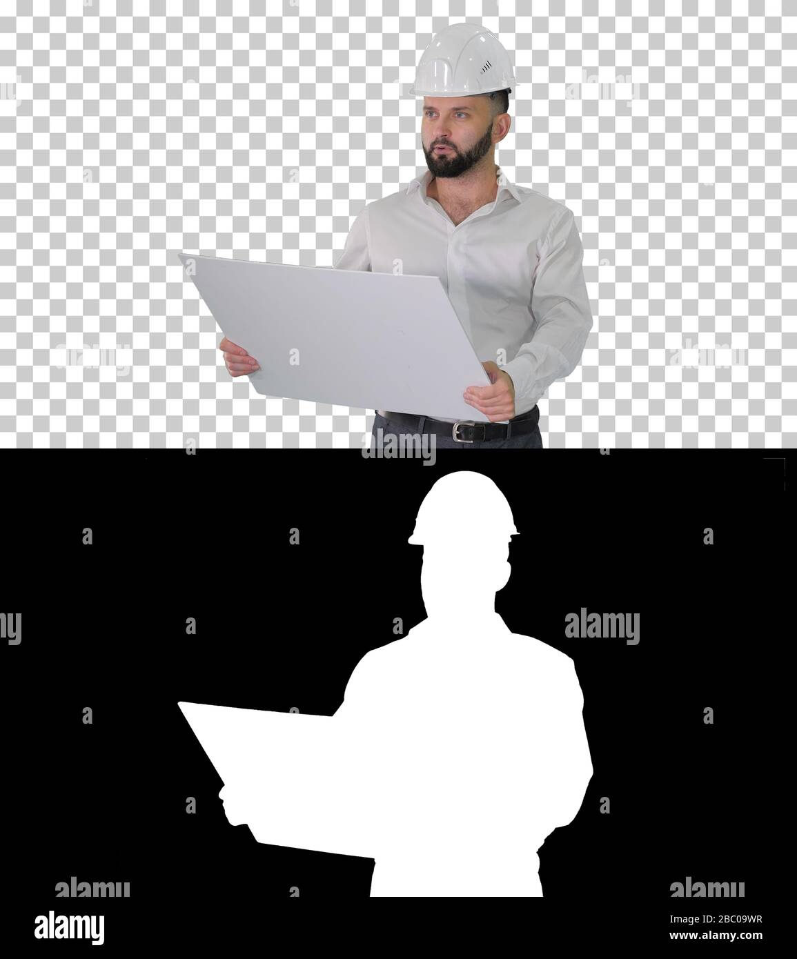 Man Engineer, der in Helm geht und das Projekt der Rekonstruktion betrachtet Stockfoto