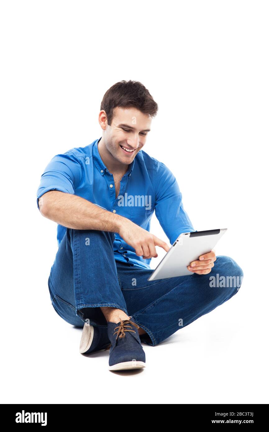 Junger Mann mit digital-Tablette Stockfoto