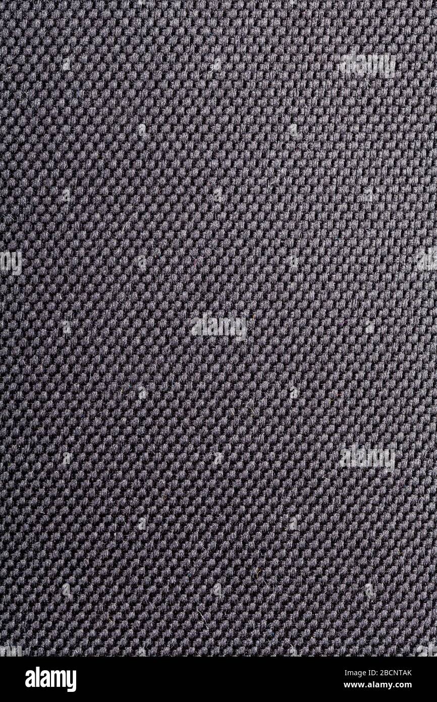 Einfache schwarze / graue dunkle Kunststoff-Textil-Material Oberflächenhintergrund Textur, wasserdicht, nicht naturbelassene Faserdetails, gewebte abstrakte Kulisse Stockfoto