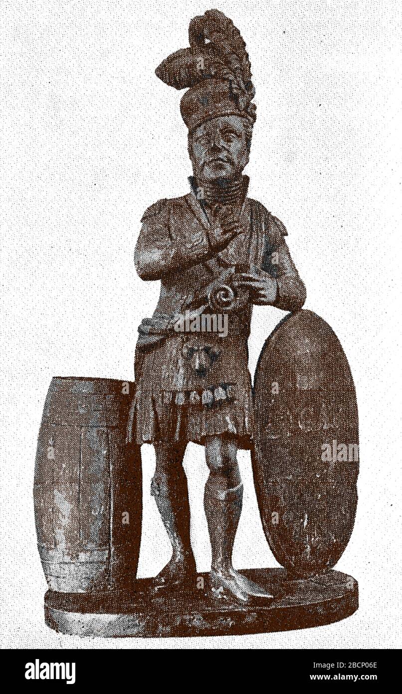 Ein Schild mit Holztabakladen aus dem 18. Jahrhundert. Obwohl die Figur in einem Kilt als Scotsman erscheint, repräsentiert sie tatsächlich einen einheimischen amerikanischen Indianer. Stockfoto
