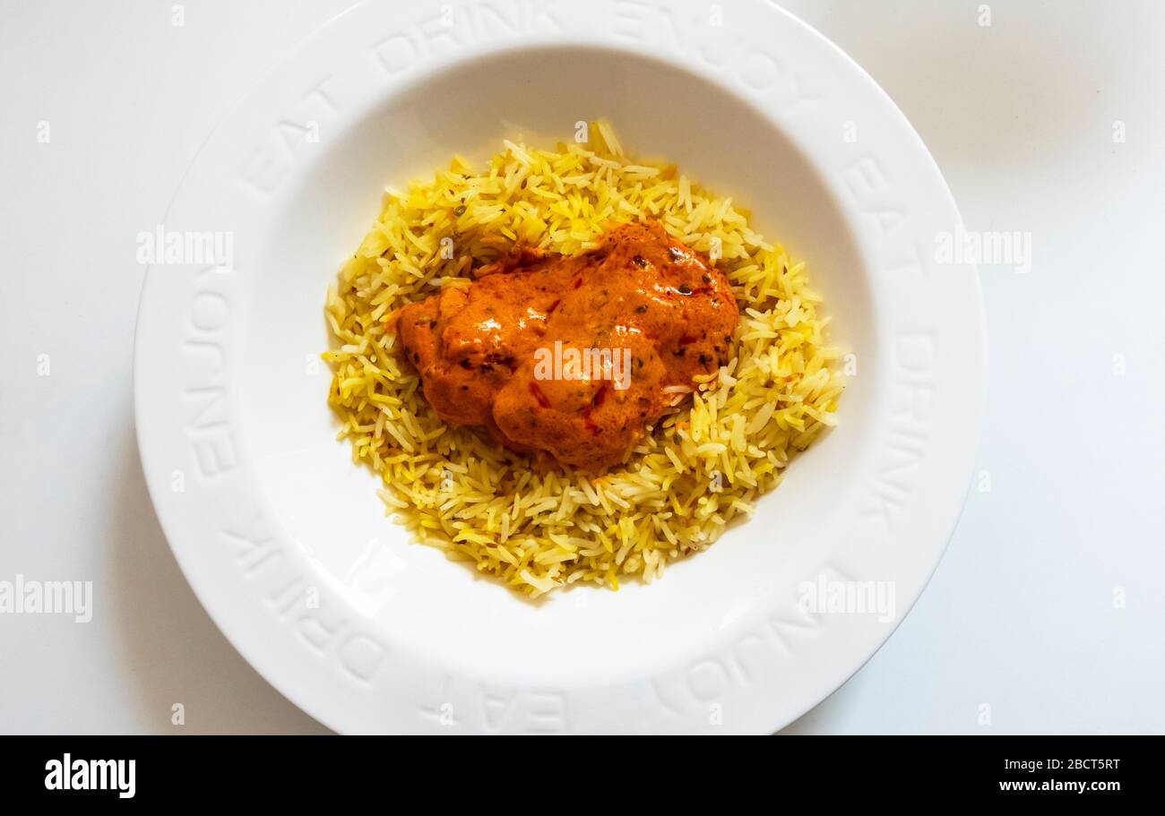 Indische Butter Huhn Curry mit Pilau-Reis Stockfoto