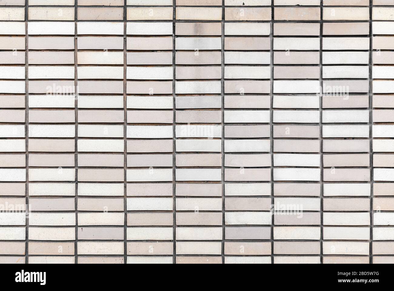 Graue Backstein-Wand Hintergrund Fotostruktur, nahtloses Muster Stockfoto