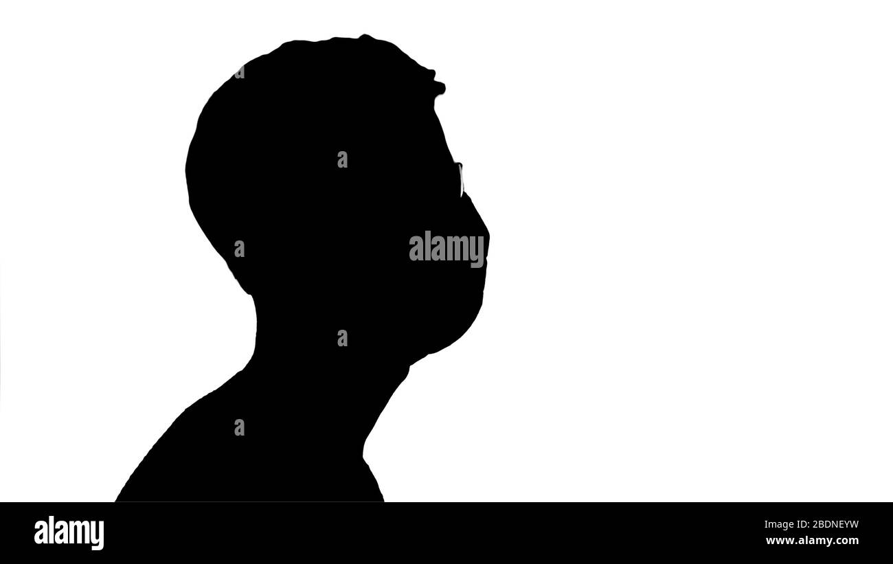 Silhouette Blinde Mann zu Fuß in medizinischen Maske und dunkle Brille. Stockfoto