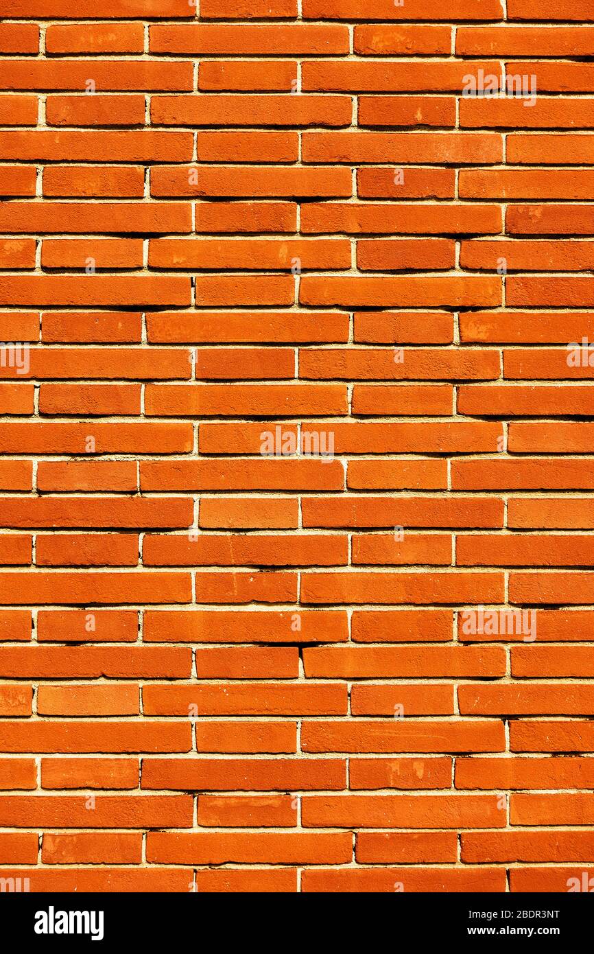 Textur der neuen roten Ziegelwand - vertikaler Hintergrund Stockfoto