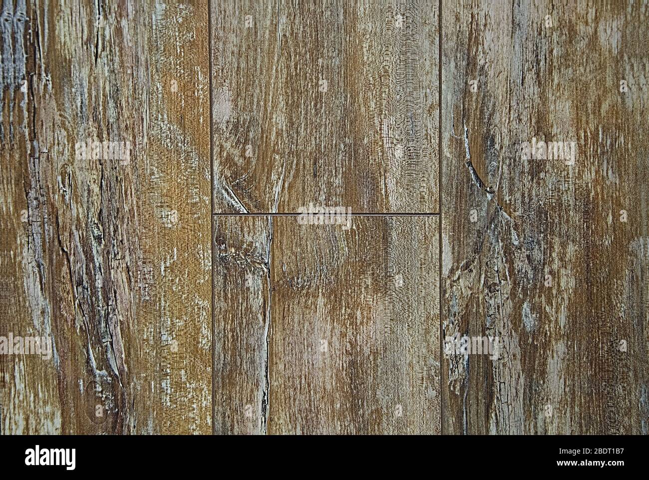 Textur der alten Bodenplatte. Hintergrund braun und grau mit weiß. Holz mit Knoten. Stockfoto