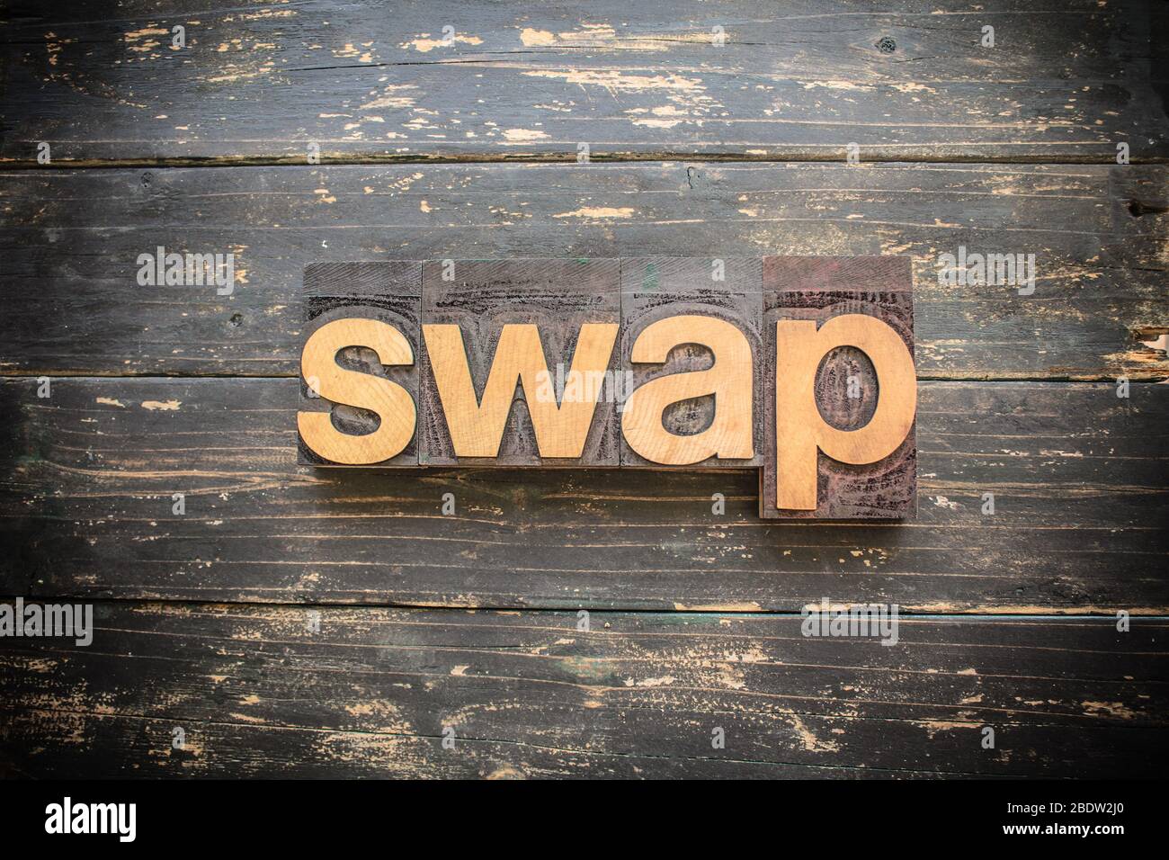 Das Wort 'SWAP' geschrieben in Vintage Holz Buchdruck auf einem rustikalen Hintergrund. Stockfoto