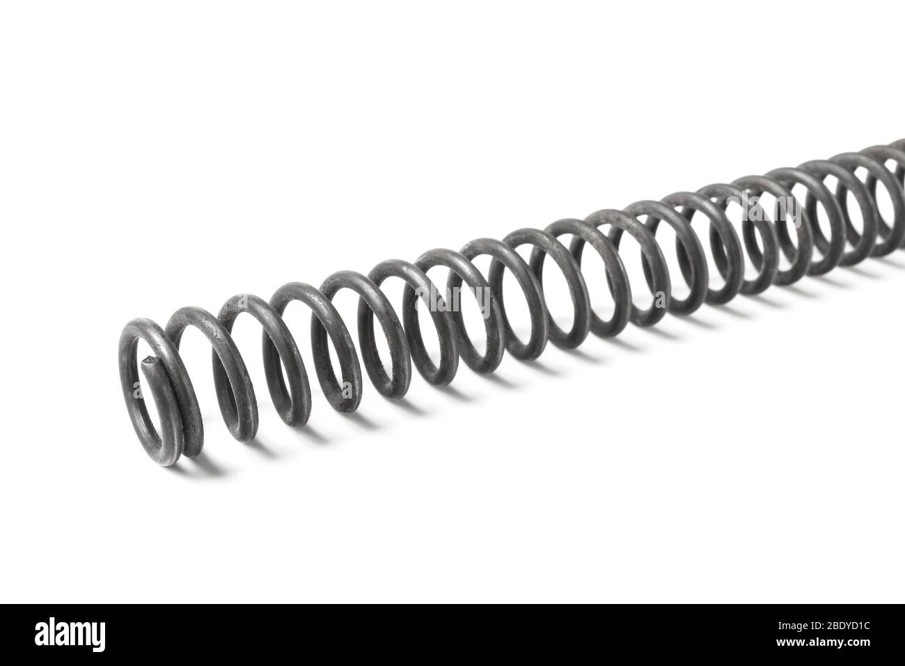 Feder für Luftgewehr isoliert auf weiß Stockfoto