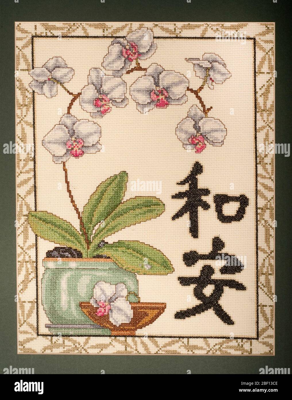 Orchideenstich mit Kreuzstich. Stockfoto
