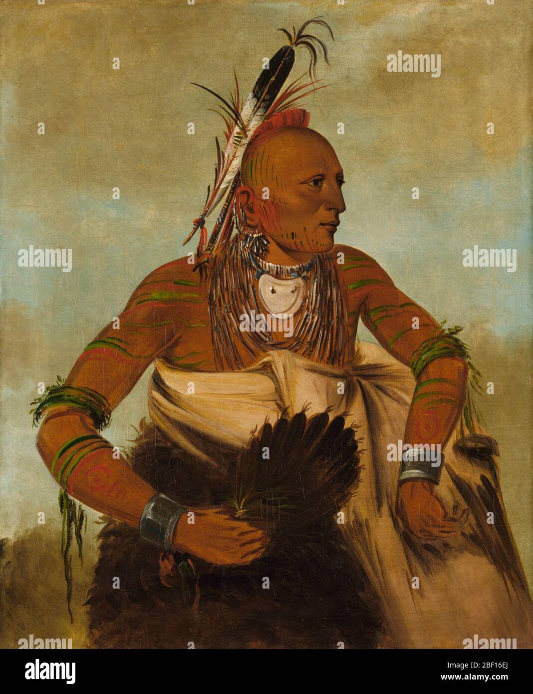 Wahobckee ein schöner tapferer. Dieses Mitglied des Stammes der Osage saß für sein Porträt in charakteristischen Stammesmarkierungen, darunter ein bemalter und rasierte Kopf sowie ein bemalter Oberkörper. Stockfoto