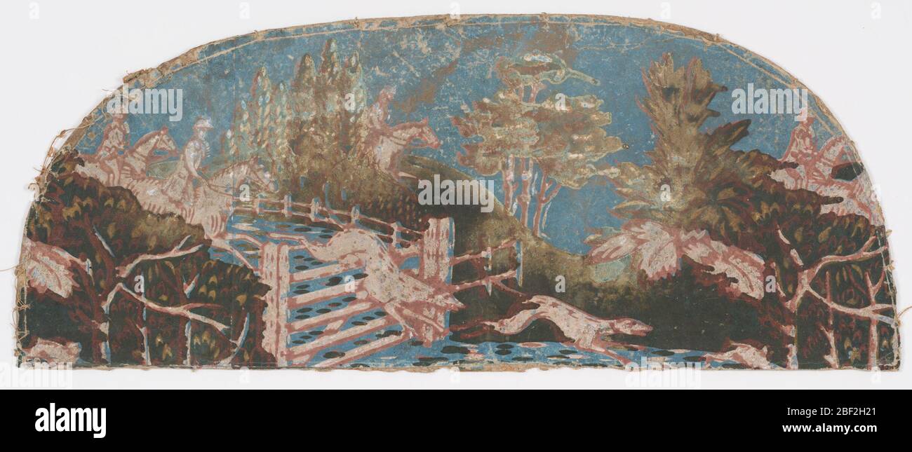 Bandbox. Teilweiser Deckel der Bandbox. Die Szene zeigt eine Jagd. Zwei berittene Reiter sind dabei, einen Schienenzaun zu behuten, über den zwei Hunde bereits gesprungen sind. Ganz rechts ist die Beute, die einem Kaninchen ähnelt. Unter den Bäumen im hinteren Bereich befinden sich zwei weitere Reitpferder. Stockfoto