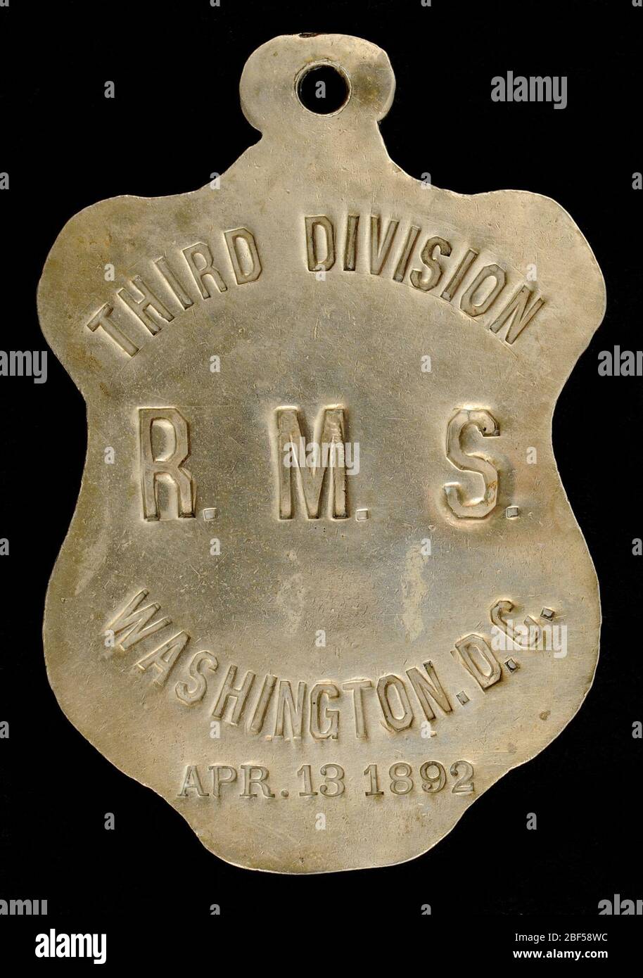 Third Division RMS Washington DC Owney Tag. Postangestellte unter der Leitung von Charles W. Vickery, 3. Division Superintendent des Bahnpostdienstes, überreichten diese Marke am 18. April 1892 an Owney. Stockfoto