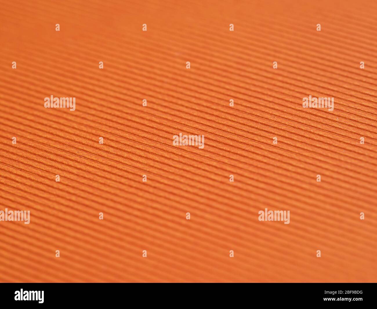 Beispiel für orangefarbenes strukturiertes Fertigpapier Stockfoto
