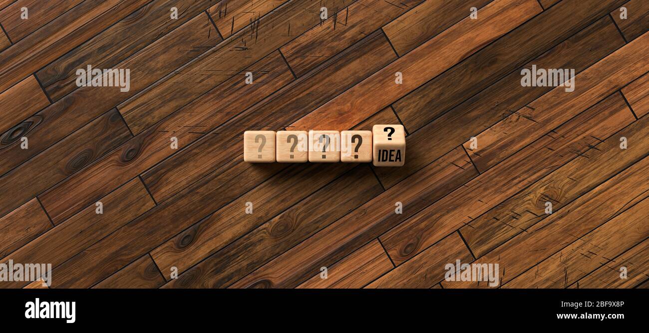 Würfel mit Fragezeichen und eine Drehung mit dem Enthüllen des Wortes IDEE vor Holzhintergrund - 3D gerenderte Illustration Stockfoto