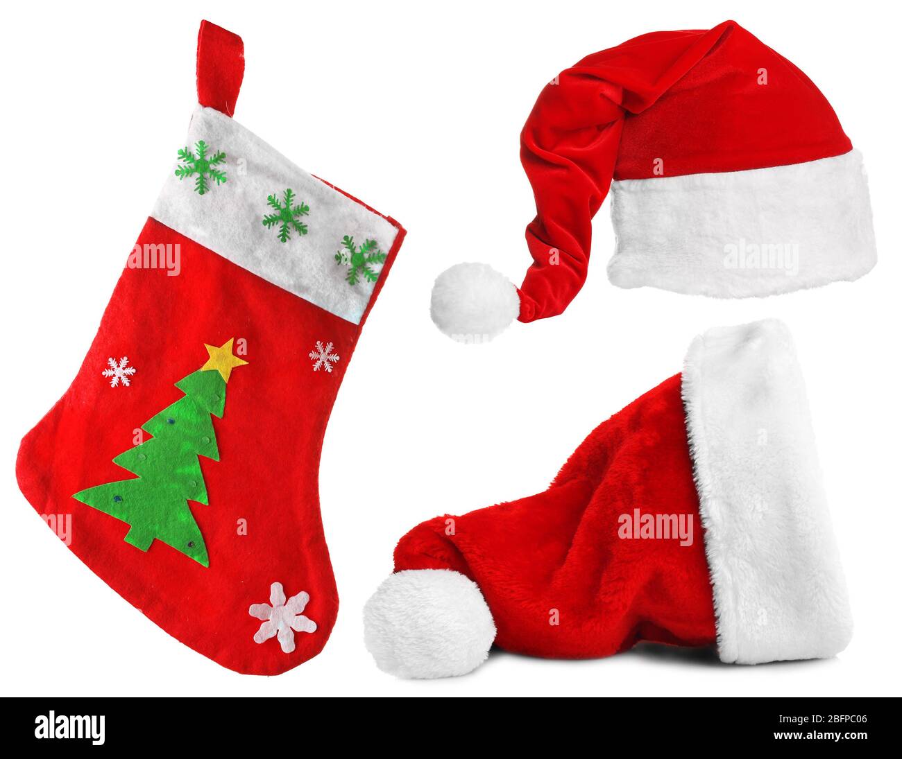 Weihnachtsmann Hüte und Weihnachtsstrumpf isoliert auf weiß Stockfoto