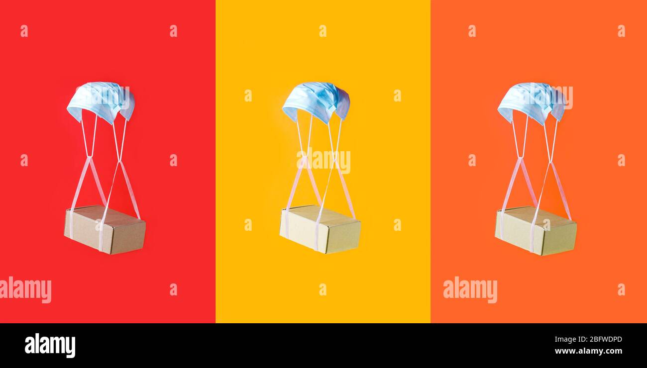 Quarantäne, kontaktlose Lieferung während eines pandemischen Coronavirus Covid-19. Zu Hause bleiben, Online-Shopping, trendy Farbblock Konzept, Box hängen an sli Stockfoto