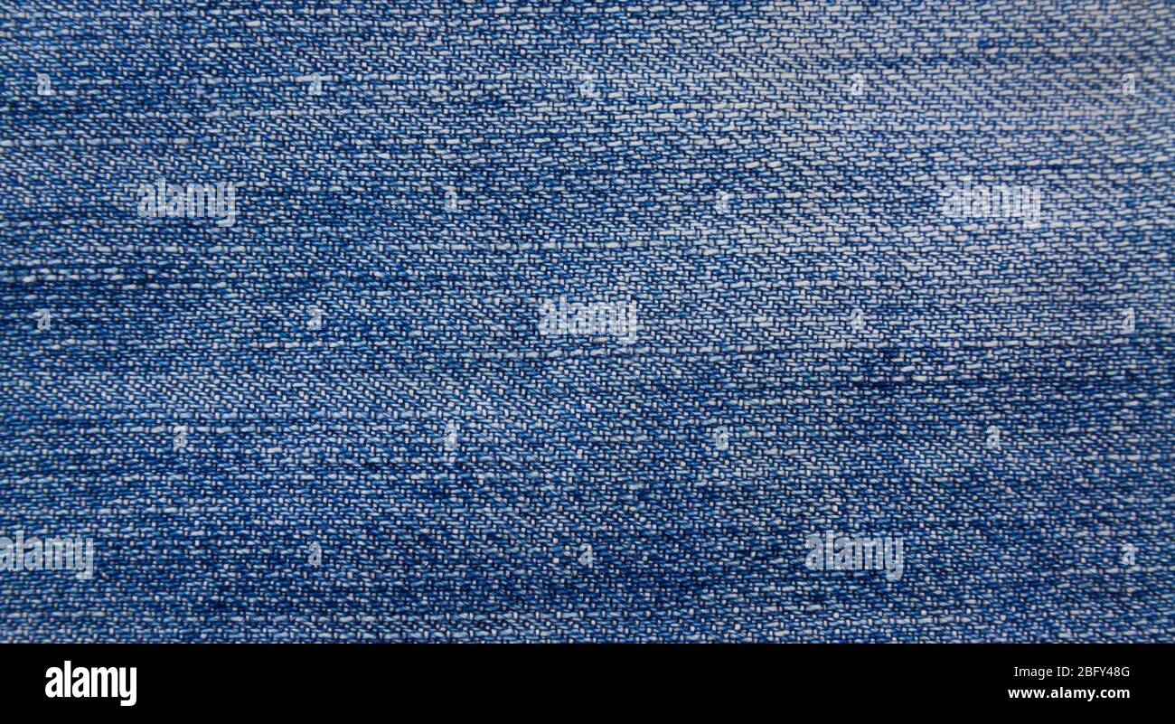 Jeans Textur Hintergrund, Textur aus blauem Denim ohne Nähte und Knöpfe close-up shot Stockfoto