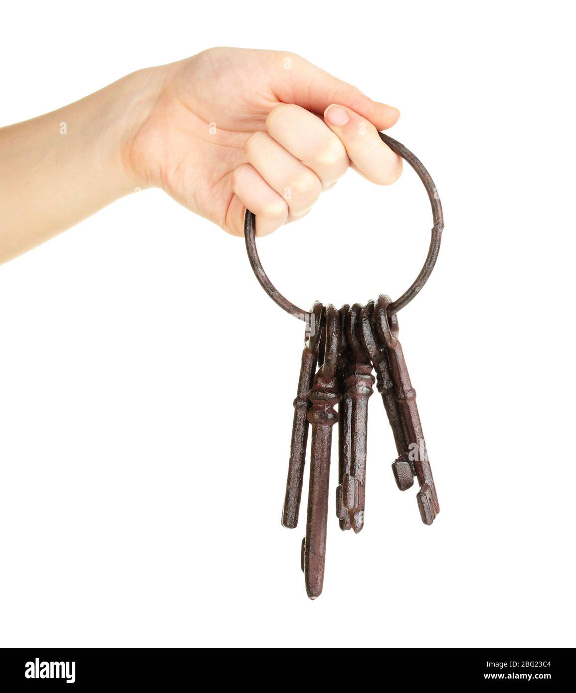 Ein Haufen alter Schlüssel in der Hand isoliert auf weiß Stockfoto