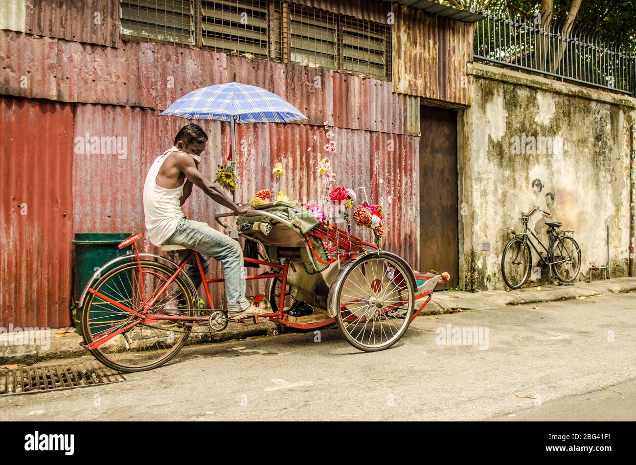 Trishaw auf den Straßen von George Town, Penang, Malaysia Stockfoto