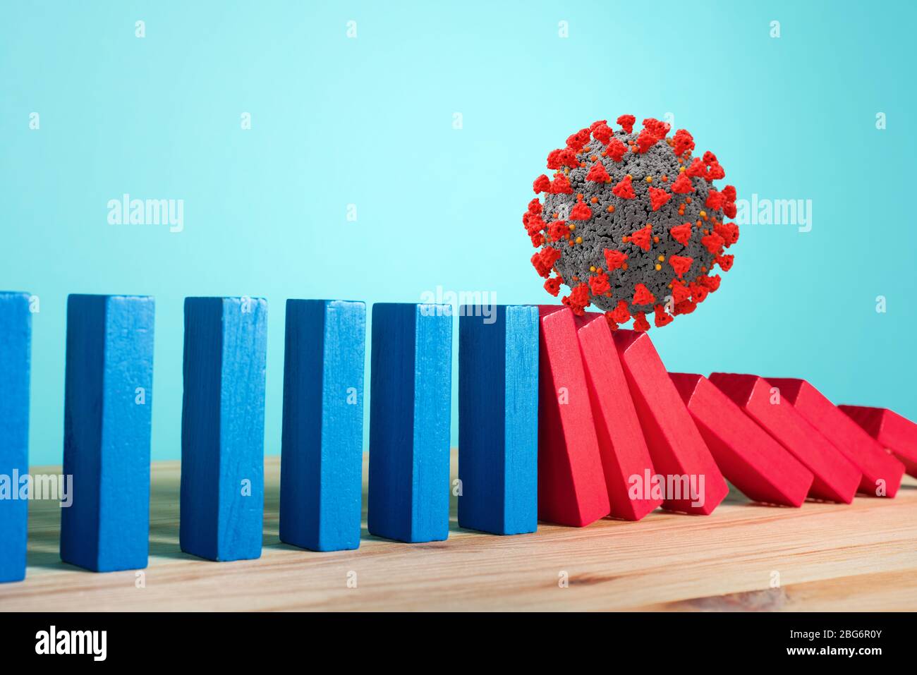 Konzept der covid19 Coronavirus Pandemie mit fallenden Kette wie ein Domino-Spiel. Ansteckung und Infektionsverlauf. Cyanfarbener Hintergrund Stockfoto