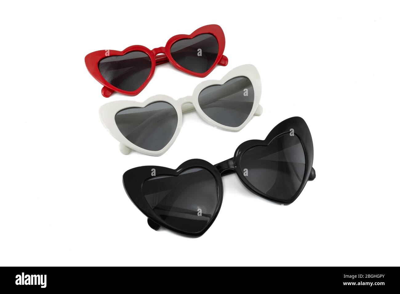 Sammlung von herzförmigen Sonnenbrille isoliert auf weißem Hintergrund. Farben Rot, Weiß und Schwarz. Vorderansicht. Stockfoto