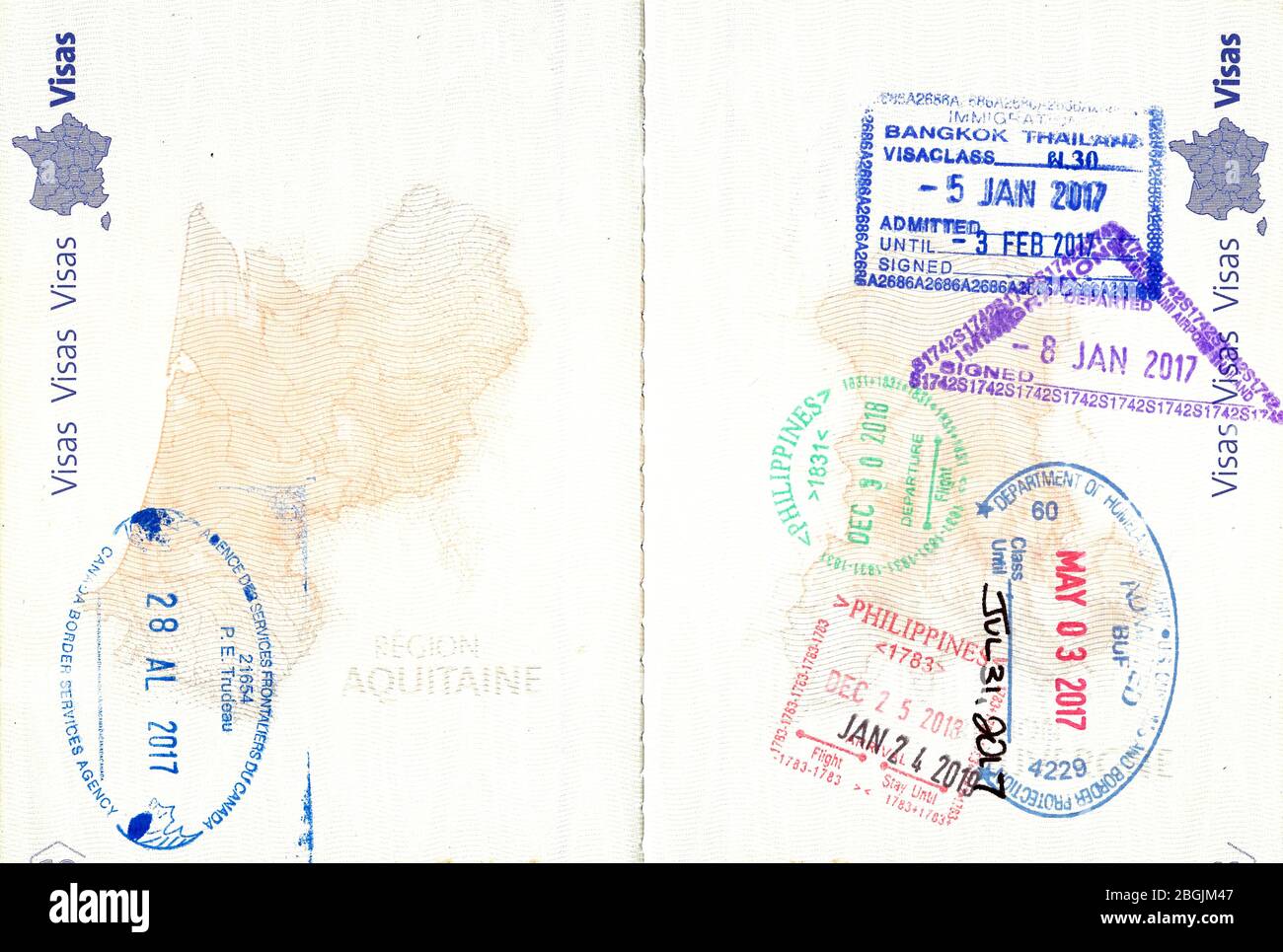 Briefmarken von Kanada, USA, Thailand und den Philippinen in einem französischen Pass Stockfoto