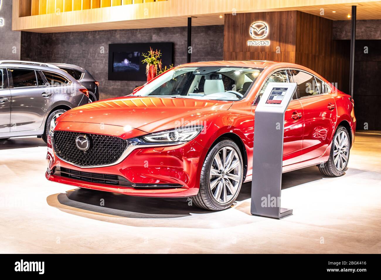 Brussels, Belgium, Jan 2020 Red Mazda vor 6 Jahren, Brussels Motor Show, 3rd gen, GL, Facelift, Mid-size car manufactured in Japan by Mazda Stockfoto