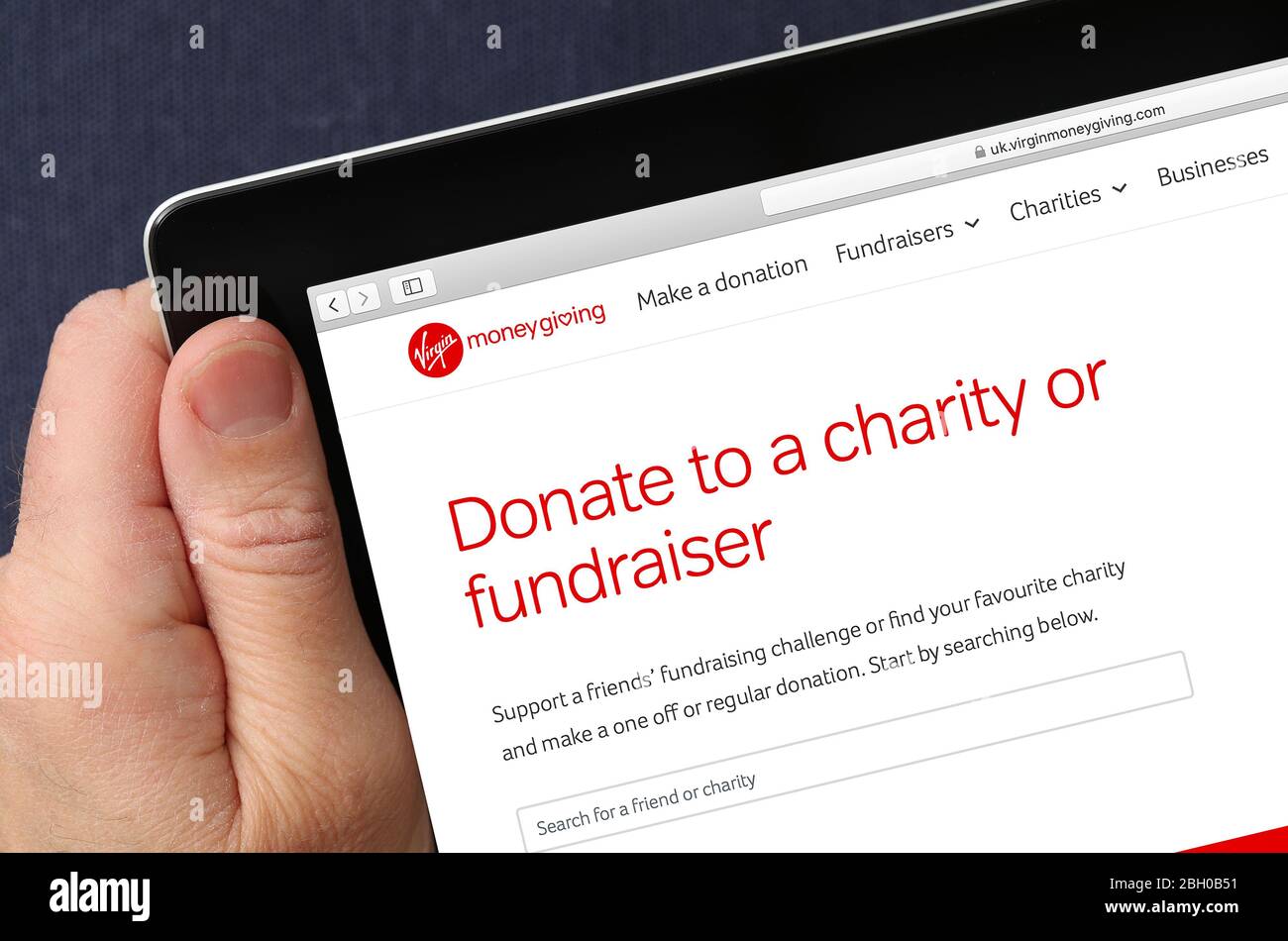 Virgin Money Giving Fundraising-Website auf einem iPad angesehen Stockfoto