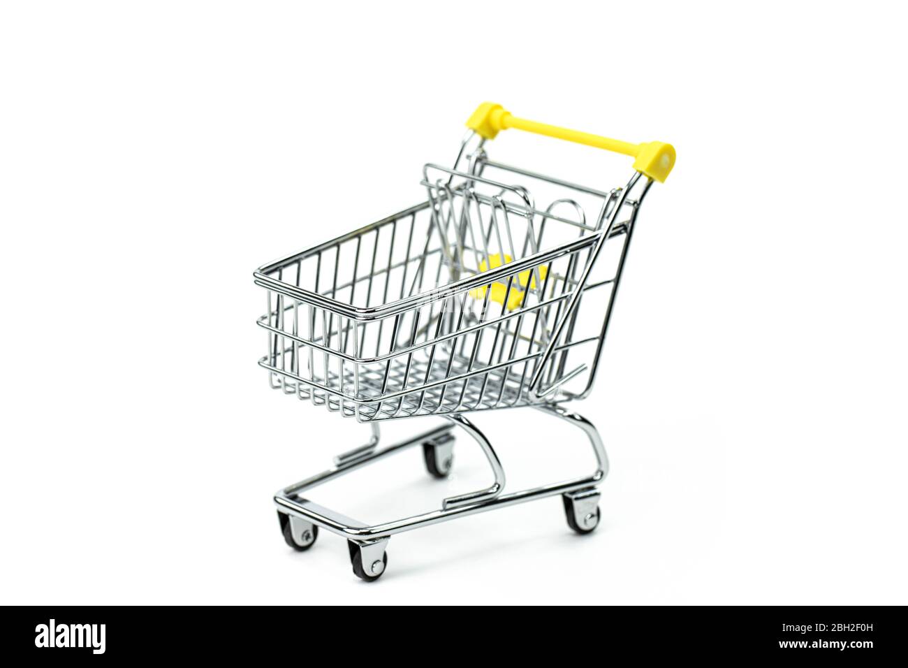 Leerer Supermarkt-Wagen - Symbol des Konsums, der Konsumgesellschaft Stockfoto